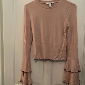Top with ruffled sleeve trimmed in black.